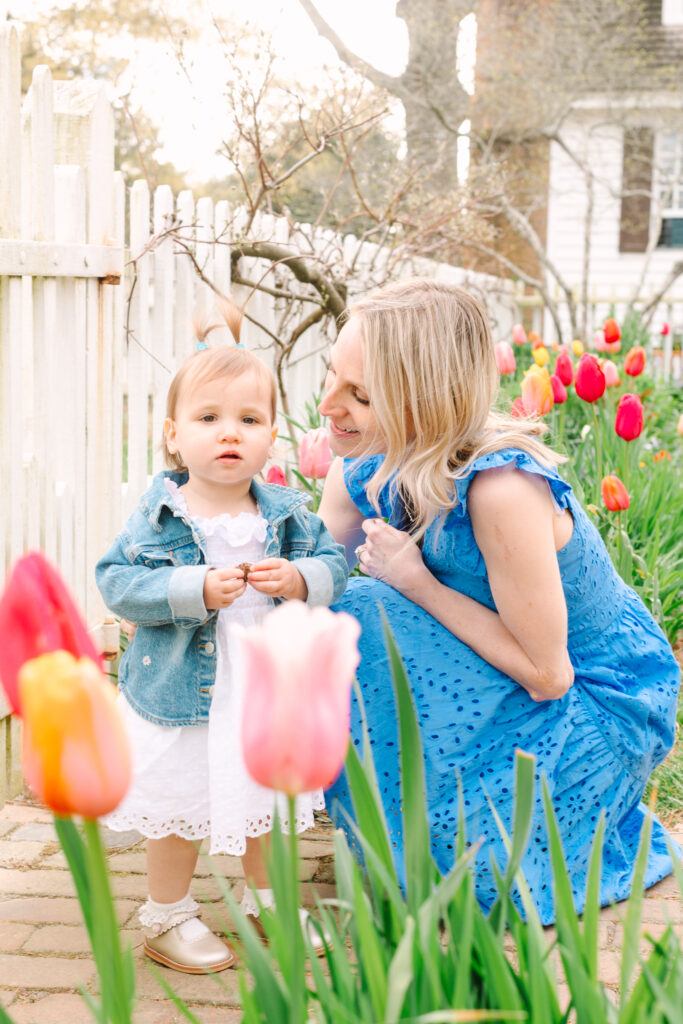 Family Portrait in Tulip Garden: Family posing in a vibrant tulip garden during a spring mini session with Rachael Reid Photography.
