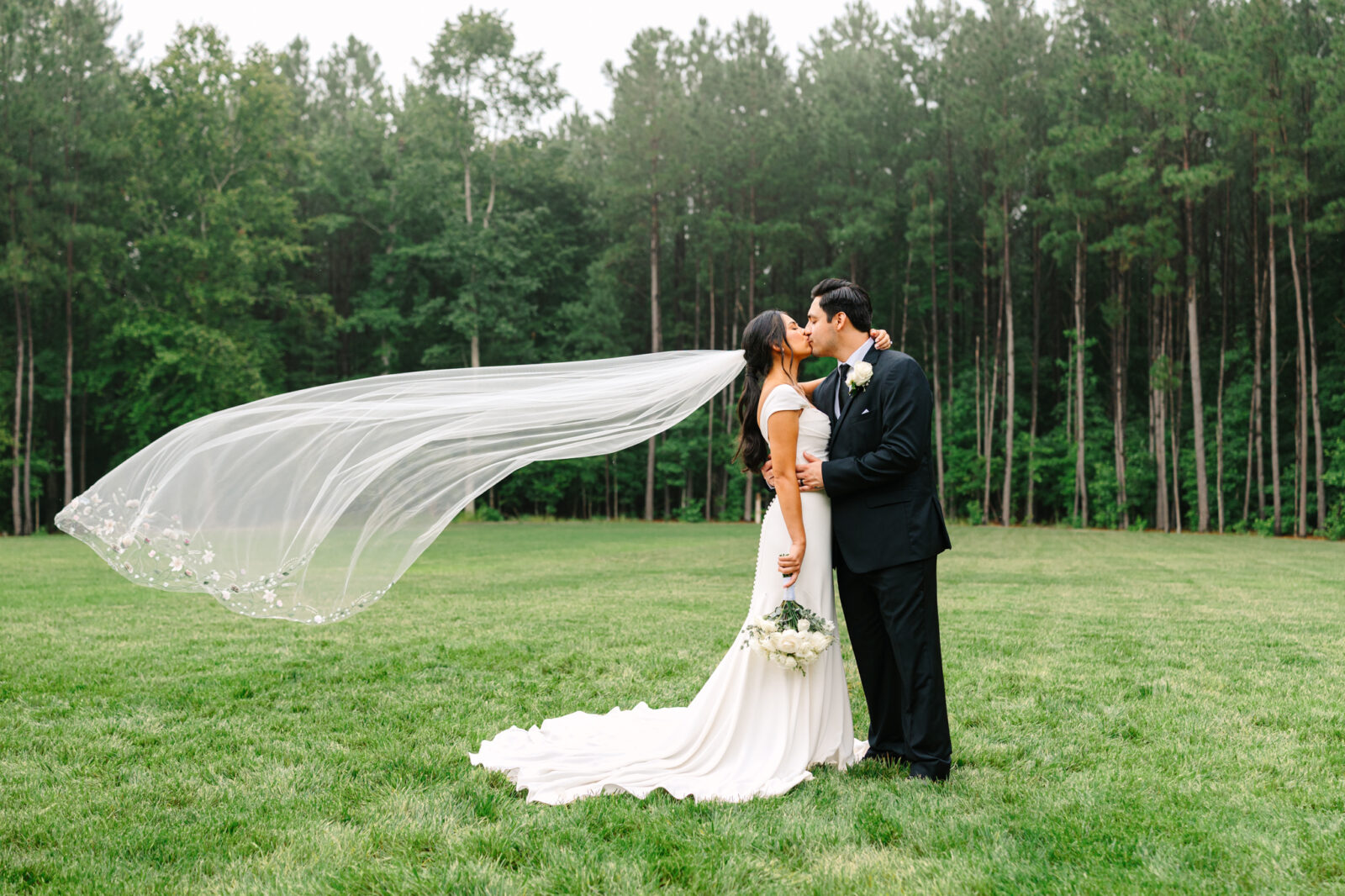 Veil toss photo of the bride and groom at The Maine of Williamsburg