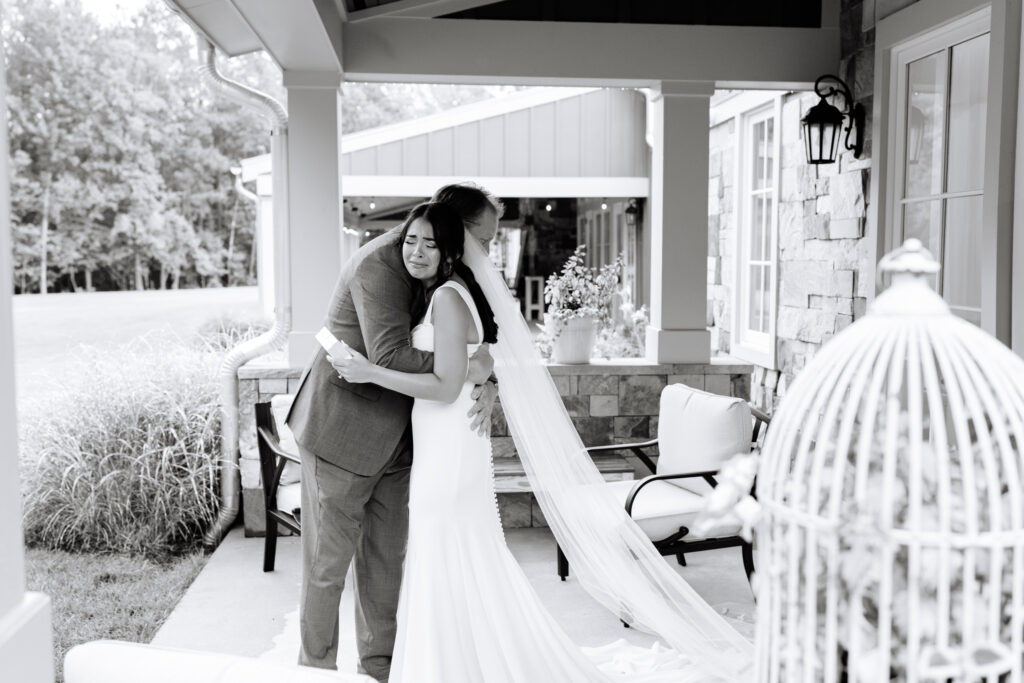 Bride sharing an emotional moment with her father before the ceremony at The Maine of Williamsburg