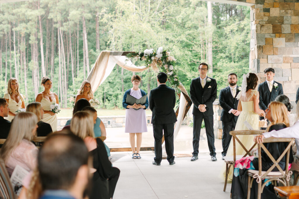 Groom facing away as the bride approaches before the ceremony at The Maine of Williamsburg