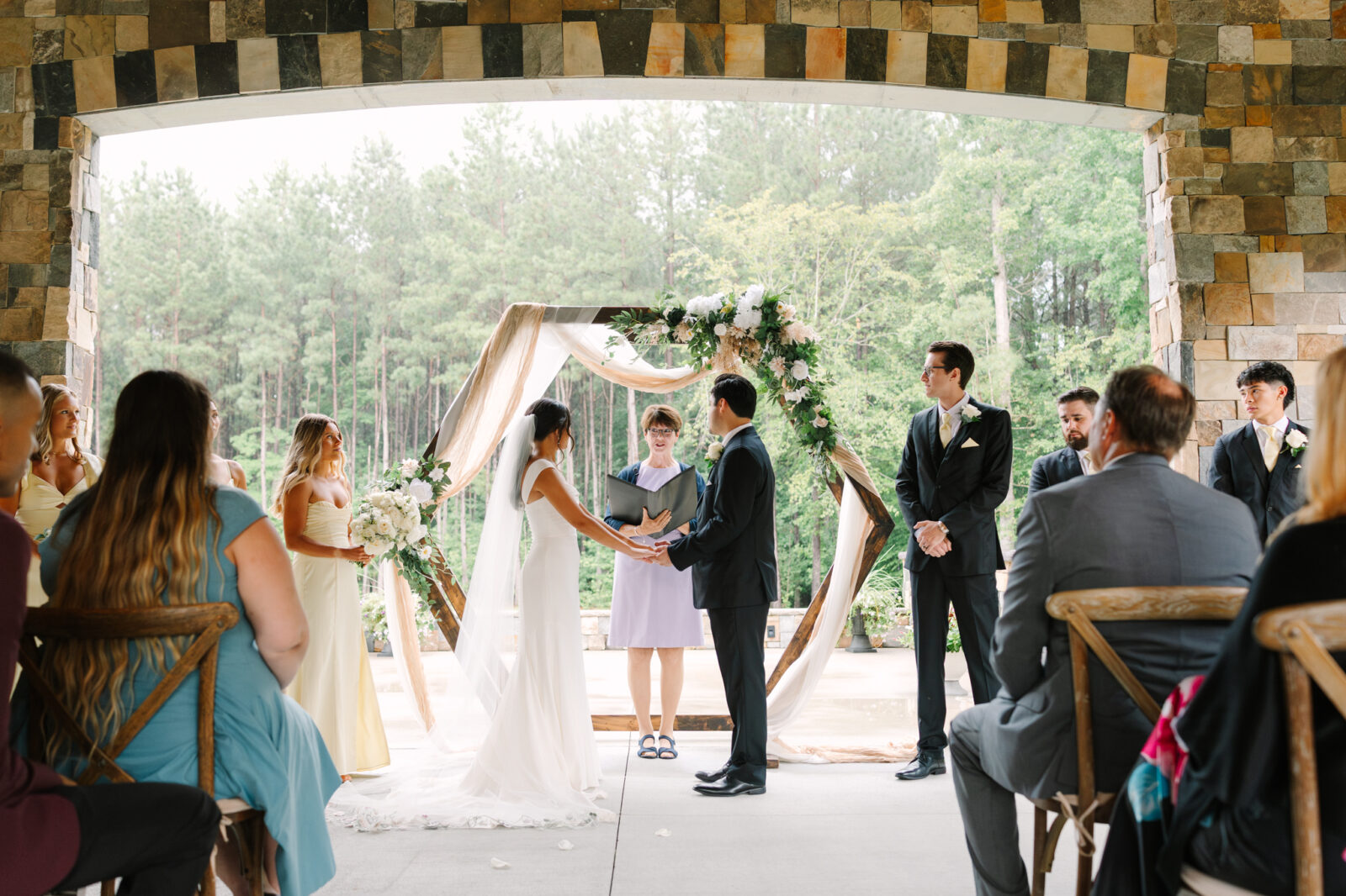 Wide view of a wedding ceremony on the Grand Porch at The Maine of Williamsburg