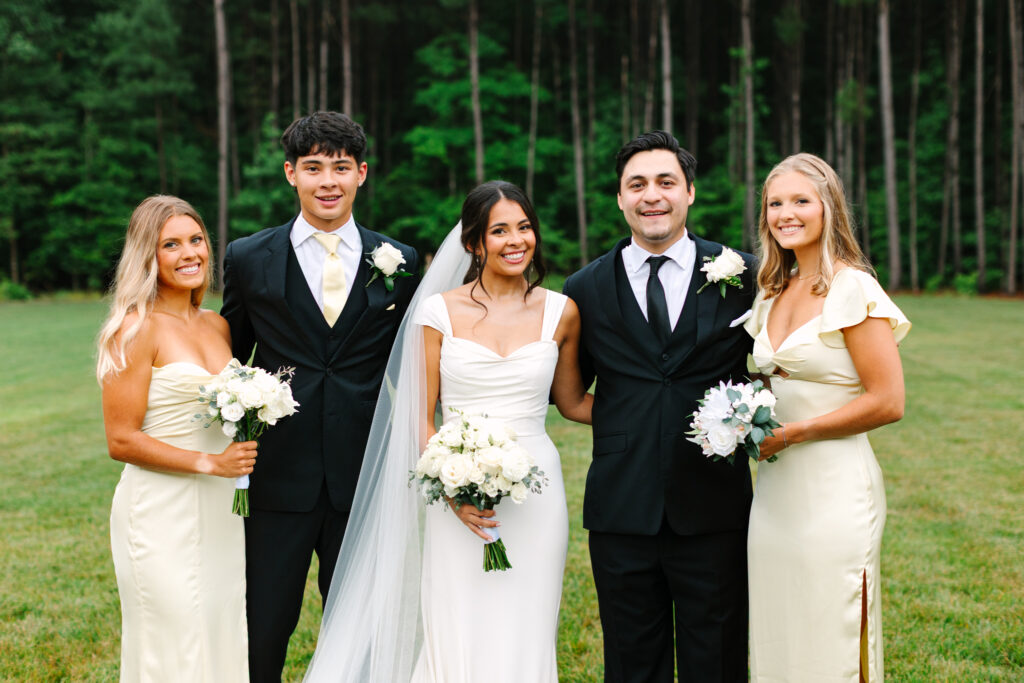 Family portraits in front of the tree line at The Maine of Williamsburg