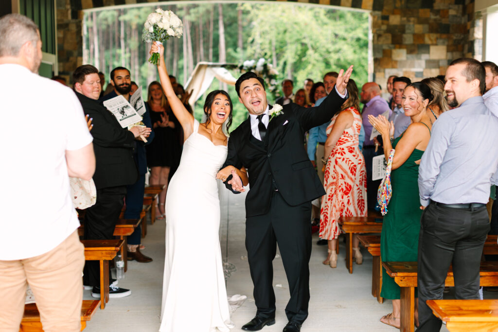 Newlyweds recessional on the Grand Porch at The Maine of Williamsburg