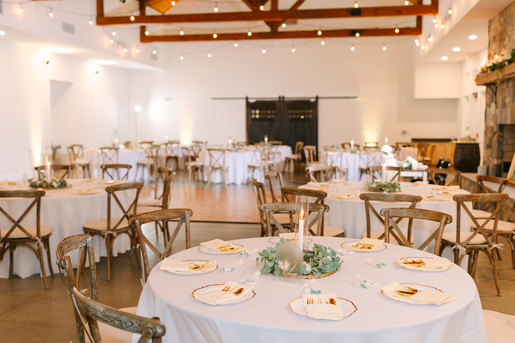 Candlelit wedding reception space in the Grand Hall at The Maine of Williamsburg