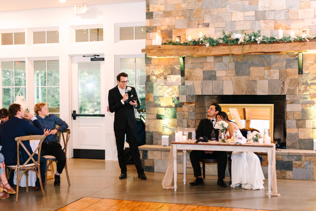 Best man giving speech during the wedding reception at The Maine of Williamsburg