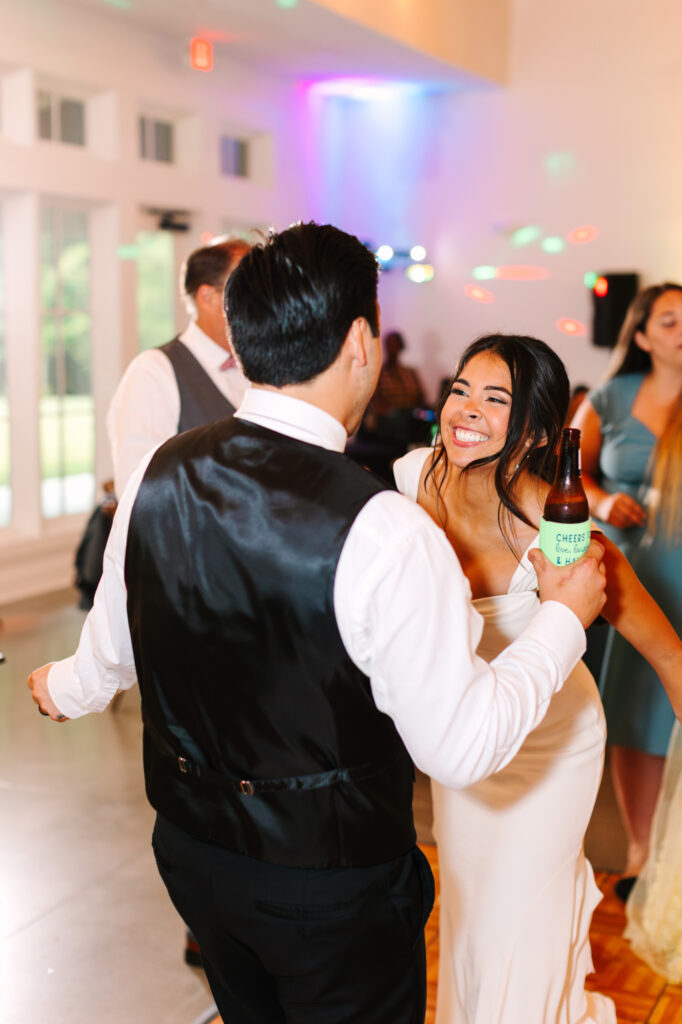 Newlyweds dancing with friends and family at The Maine of Williamsburg reception