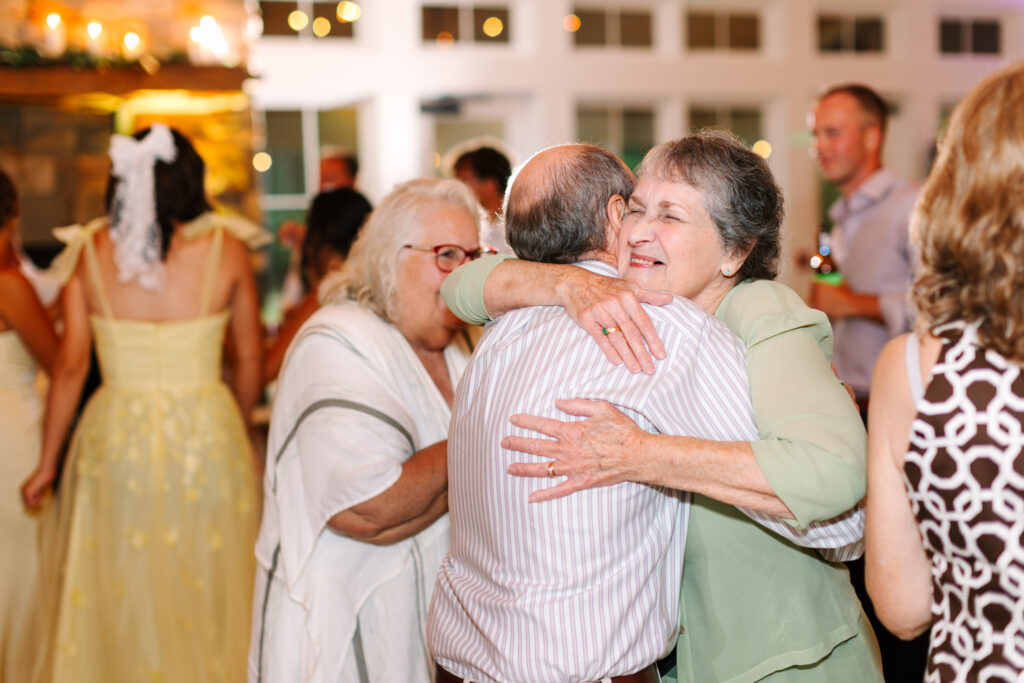 Emotional family dance floor moments at The Maine of Williamsburg wedding reception